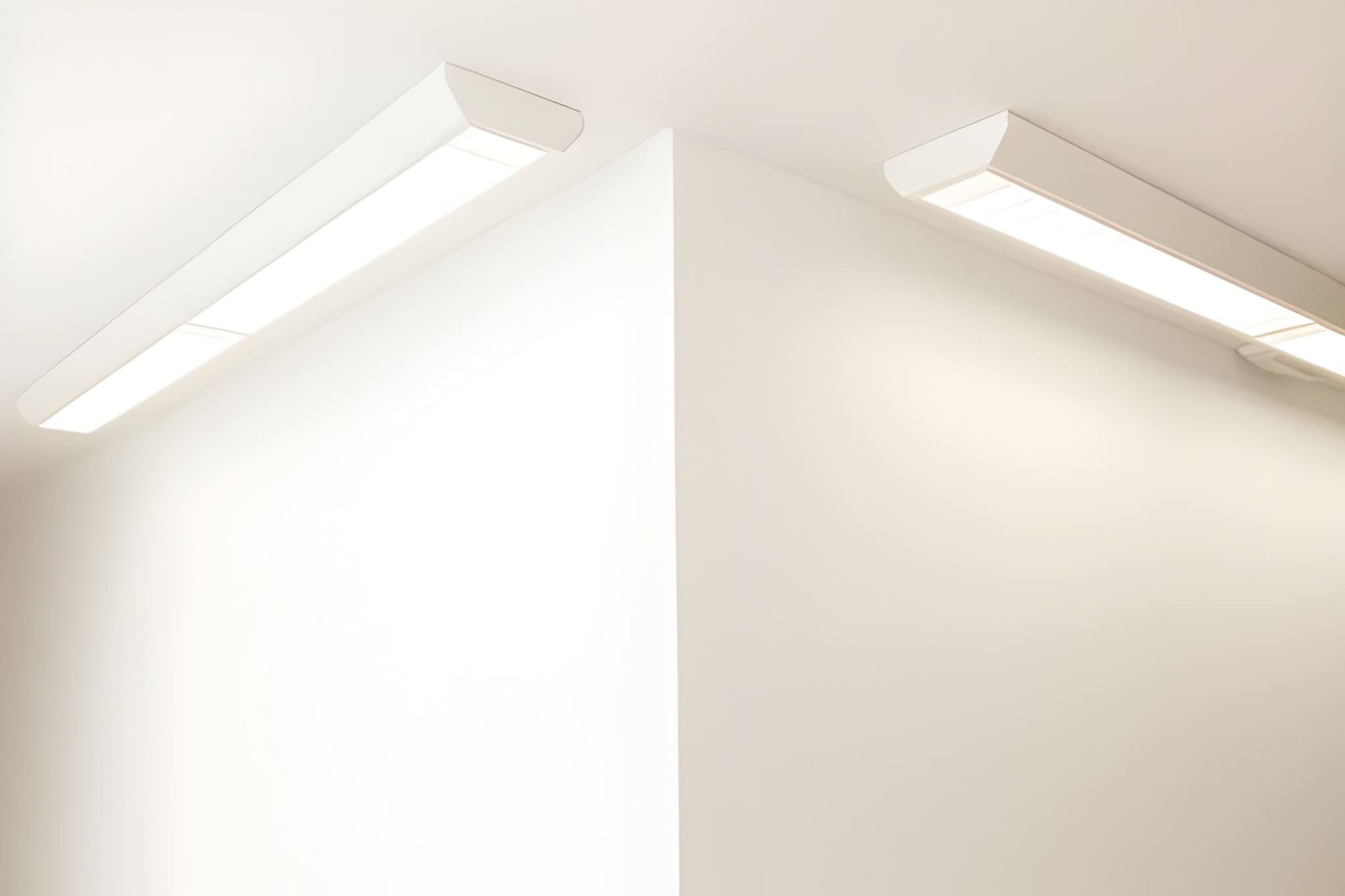 Two white rectangular lights on white ceiling.