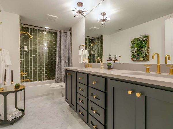Green tile gives beauty and unique charm to this basement bathroom