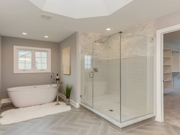 Master bathroom with freestanding tub and large all glass shower